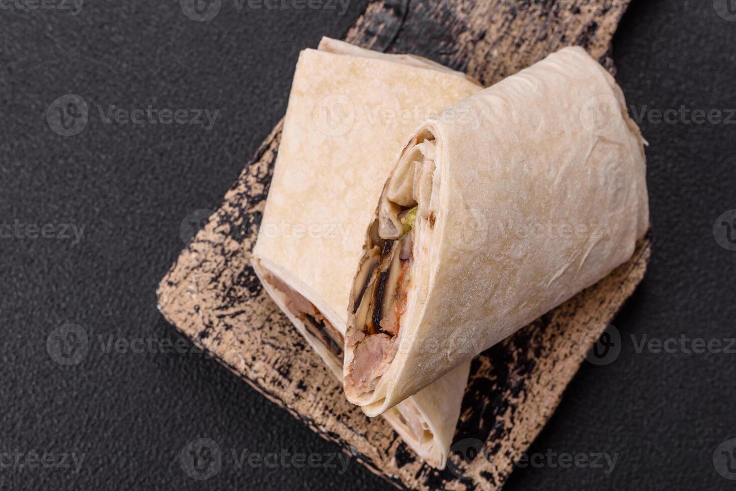 Delicious traditional shawarma or doner kebab with beef, mushrooms photo
