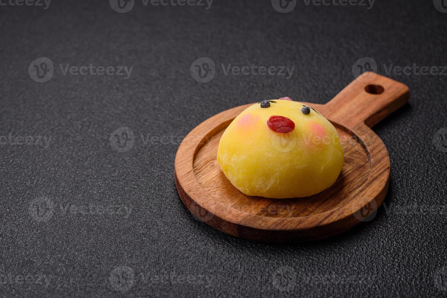 Delicious cold Japanese mochi dessert with colorful rice dough shell and fruit filling photo