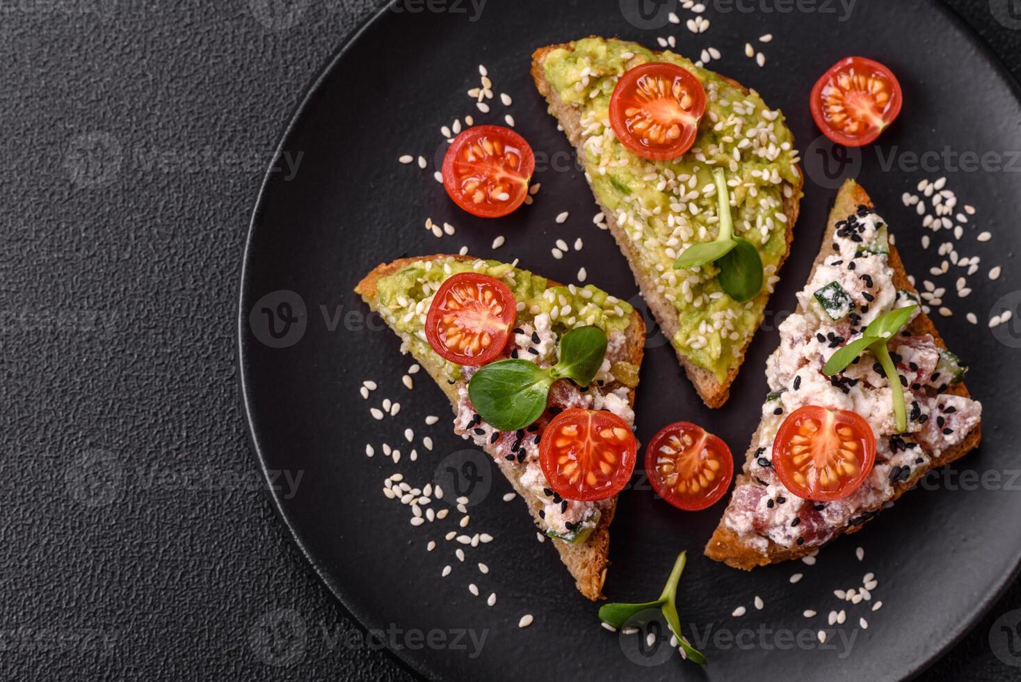 Crispy sandwich or bruschetta with guacamole, tuna and flax seeds photo