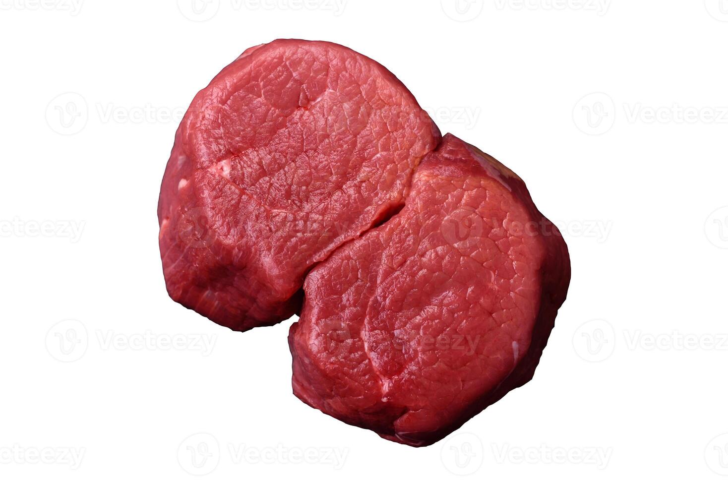 Fresh juicy raw beef medallions with salt and spices photo