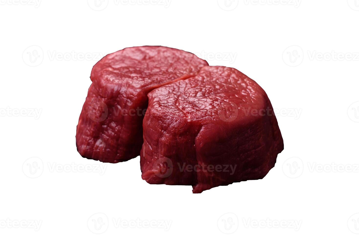 Fresh juicy raw beef medallions with salt and spices photo