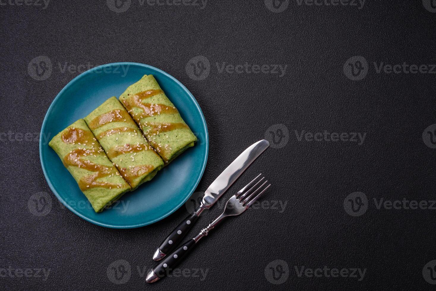 Spinach Crepes stuffed with chicken, mushrooms, salt and spices photo