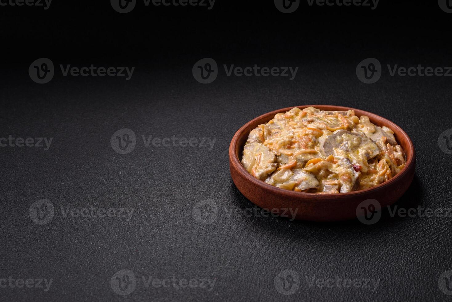 Delicious boiled beef or pork tongue sliced with carrots, onions, sour cream photo