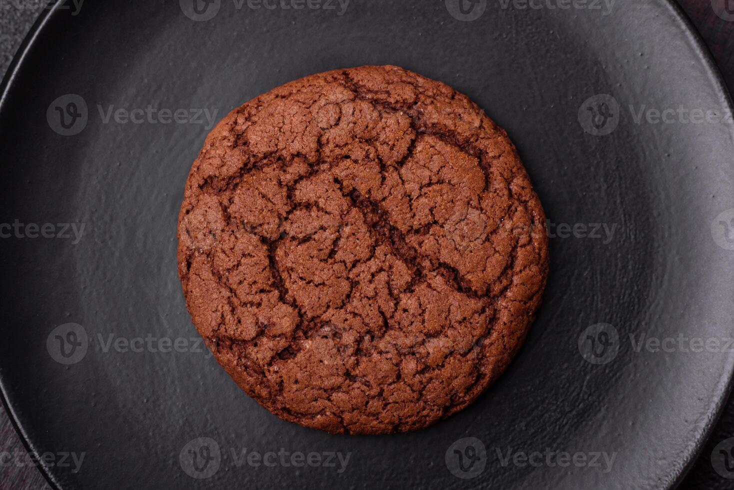 Delicious crispy round oatmeal cookies with chocolate photo