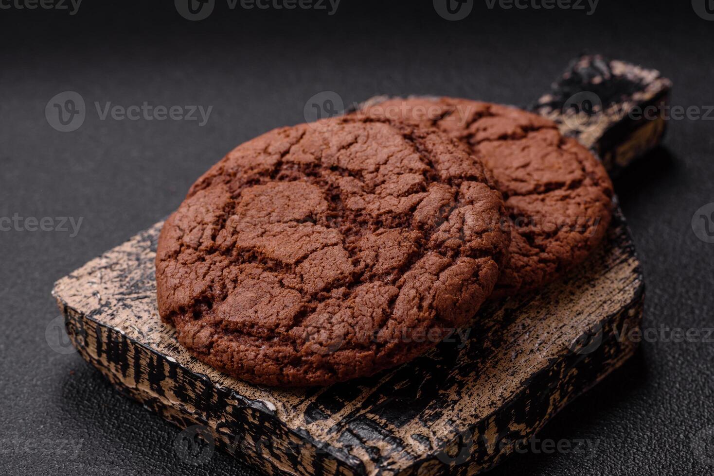 Delicious crispy round oatmeal cookies with chocolate photo