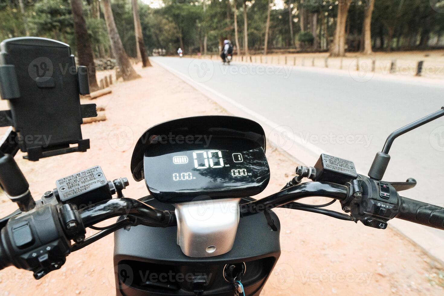 Close up electric motorbike scooter display on with parking sign and parameters displayed photo