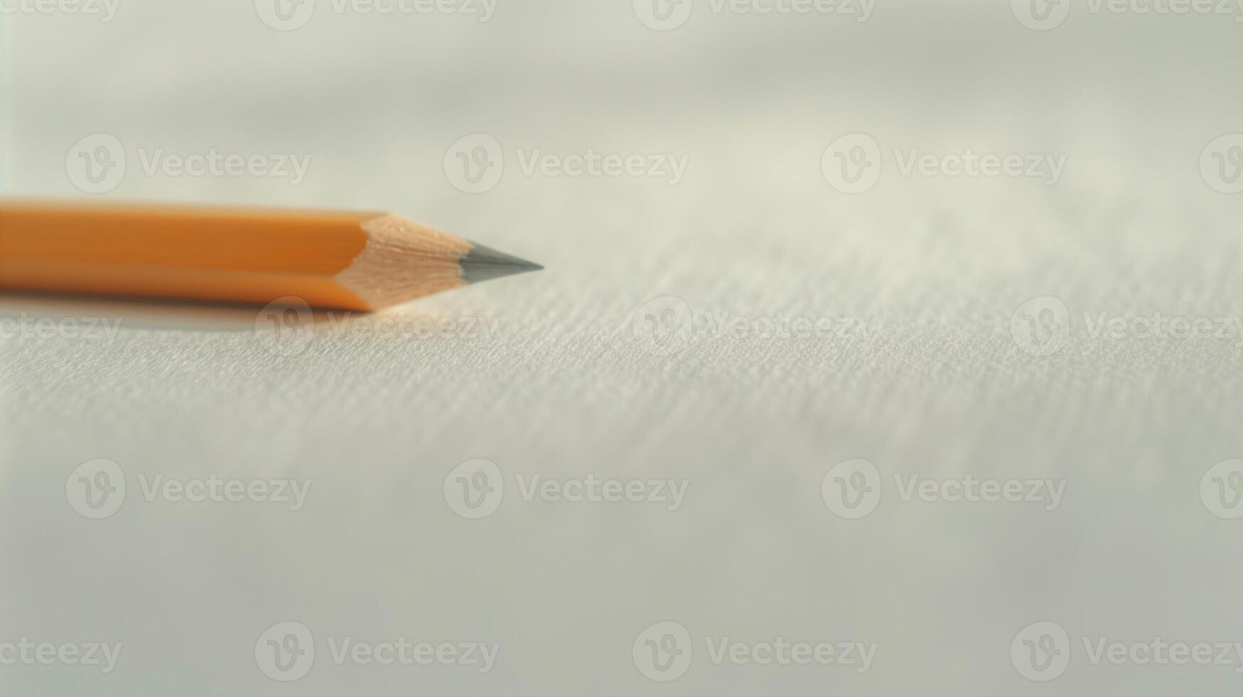 Sharp Yellow Pencil on Blank White Textured Paper - Minimalist Creative Workspace, Education and Writing Concept, Close-Up Focus photo