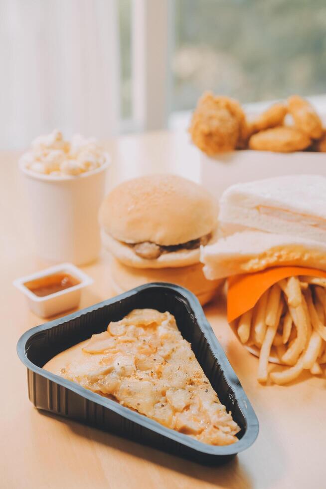 Multiple type of Fast food on table. photo