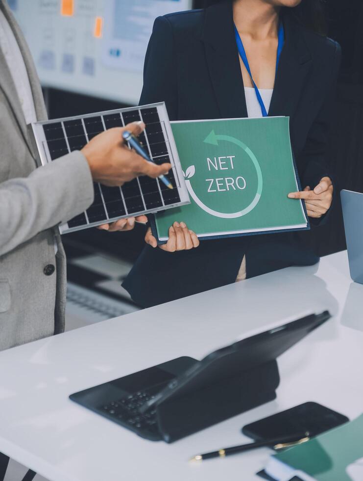 Carbon offset price report CO2 emission. Future growth Net zero waste in ESG ethical SME office protect climate change global warming social issues project. Group of asia people Eco friendly SDGs plan photo