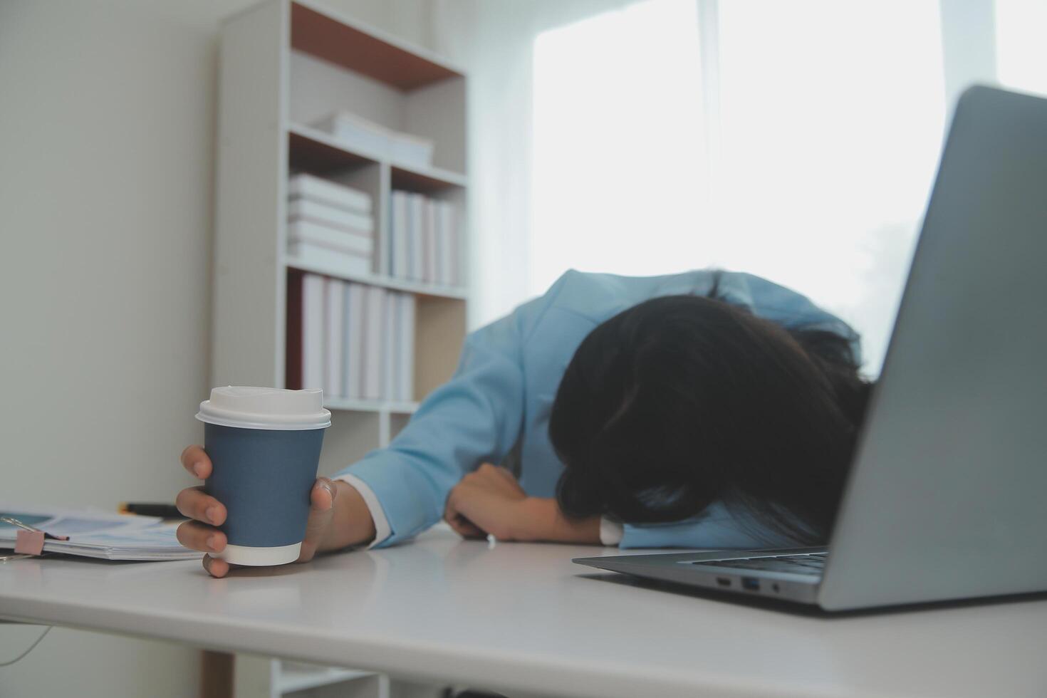 Tired teen girl rubbing dry irritable eyes feel eye strain tension migraine after computer work, exhausted young Asian woman student relieving headache pain, bad weak blurry vision, eyesight problem photo