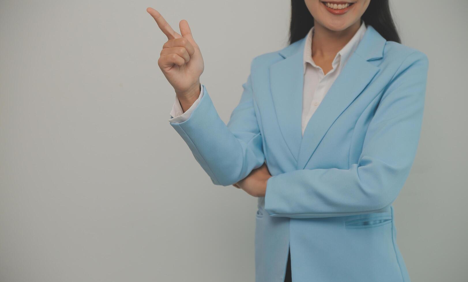 Young business arab woman isolated against a white background who feels confident, crossing arms with determination. photo