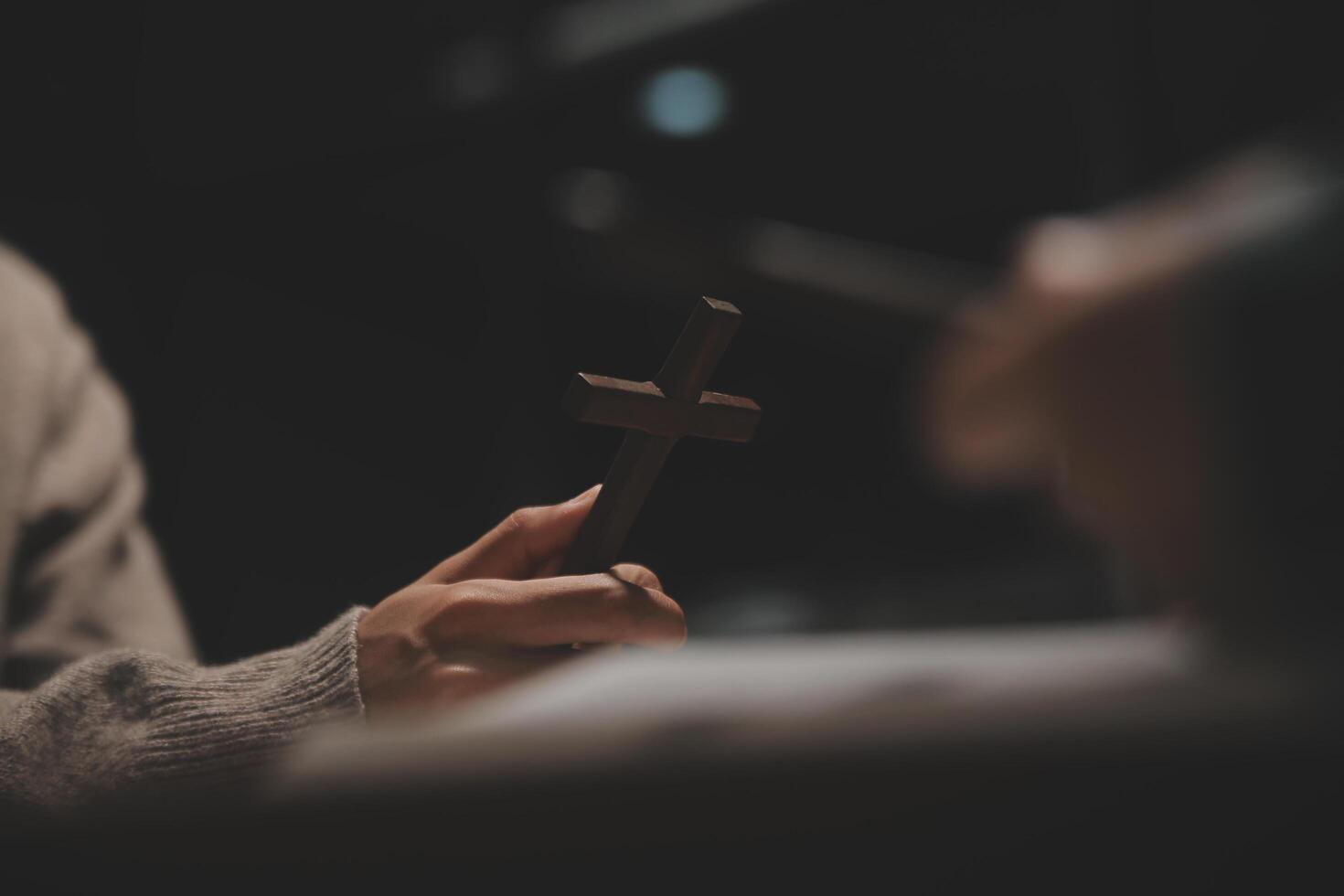 Christian group are praying to god with the bible and sharing the gospel. Concept of faith for god. photo