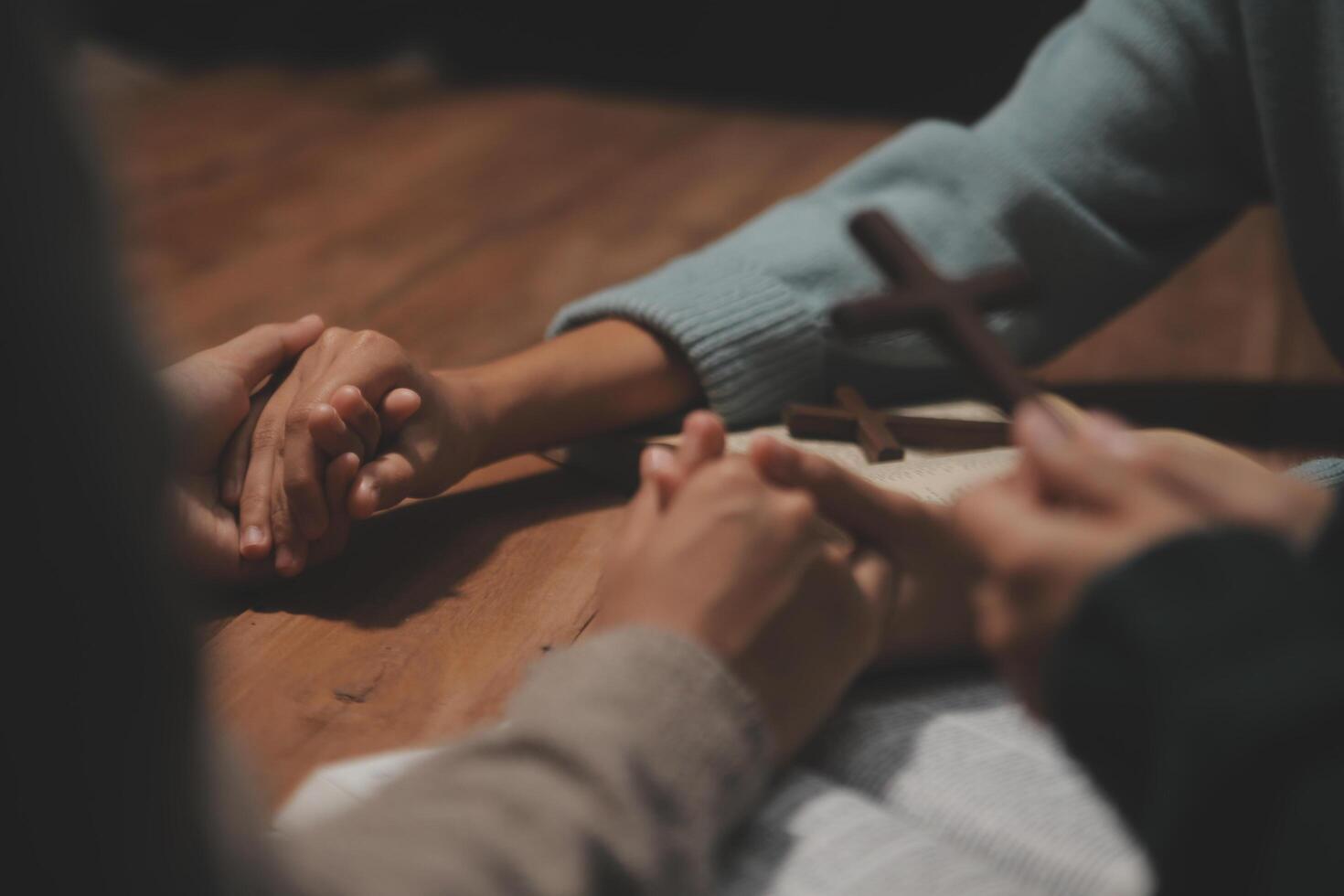 Christian group are praying to god with the bible and sharing the gospel. Concept of faith for god. photo