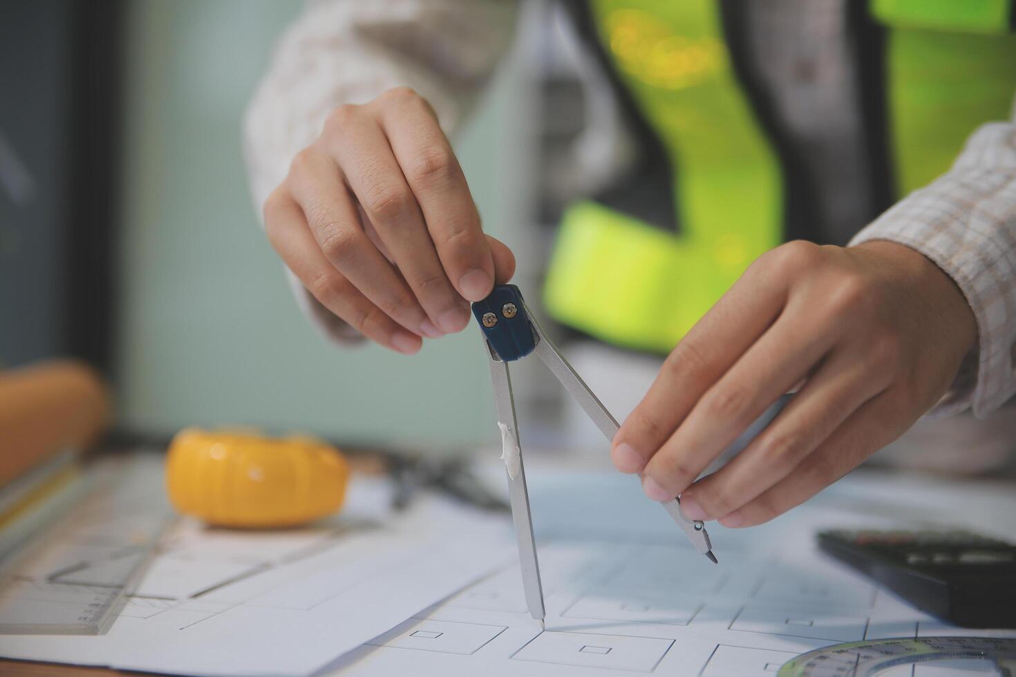 engineer people meeting working and pointing at a blueprint in office for discussing. Engineering tools and construction concept photo