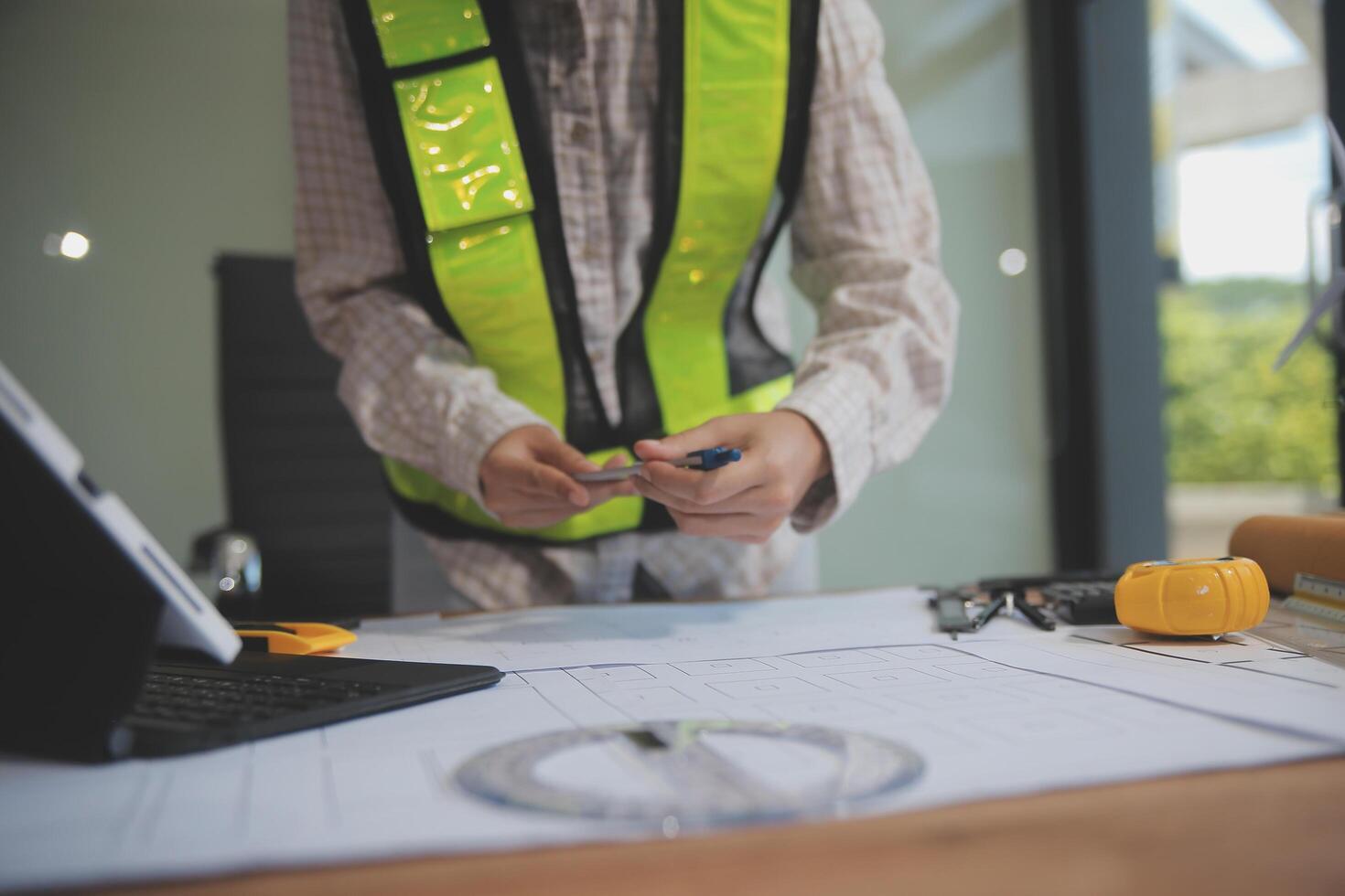 engineer people meeting working and pointing at a blueprint in office for discussing. Engineering tools and construction concept photo