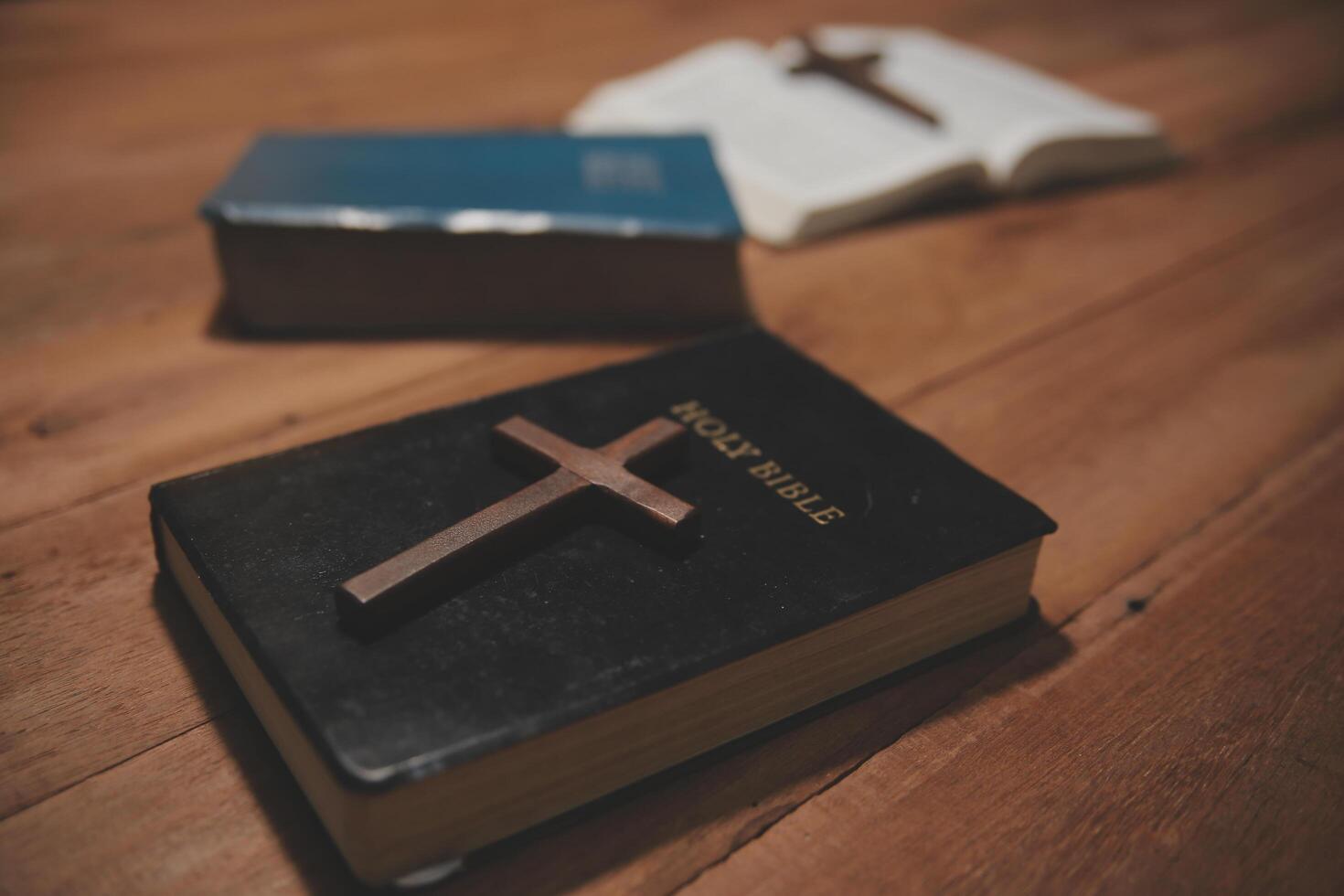 Christian group are praying to god with the bible and sharing the gospel. Concept of faith for god. photo