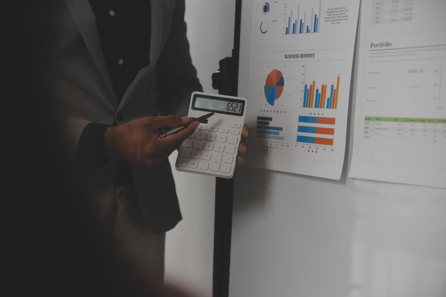 Close up of Business team analyzing income charts and graphs with modern laptop computer. Business analysis and strategy concept. photo