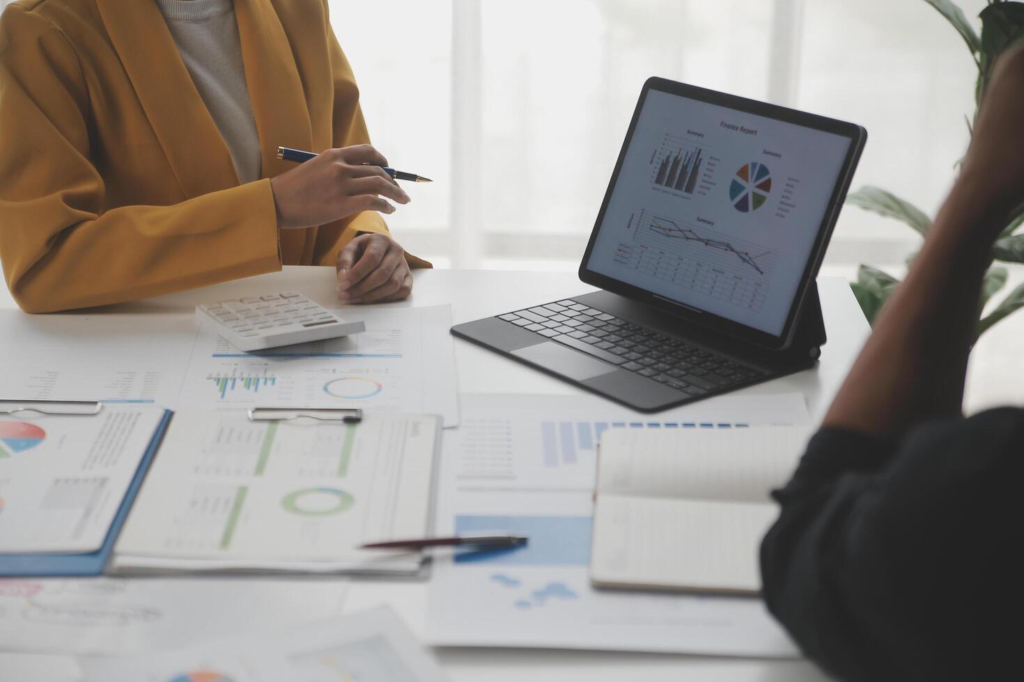 Close up of Business team analyzing income charts and graphs with modern laptop computer. Business analysis and strategy concept. photo