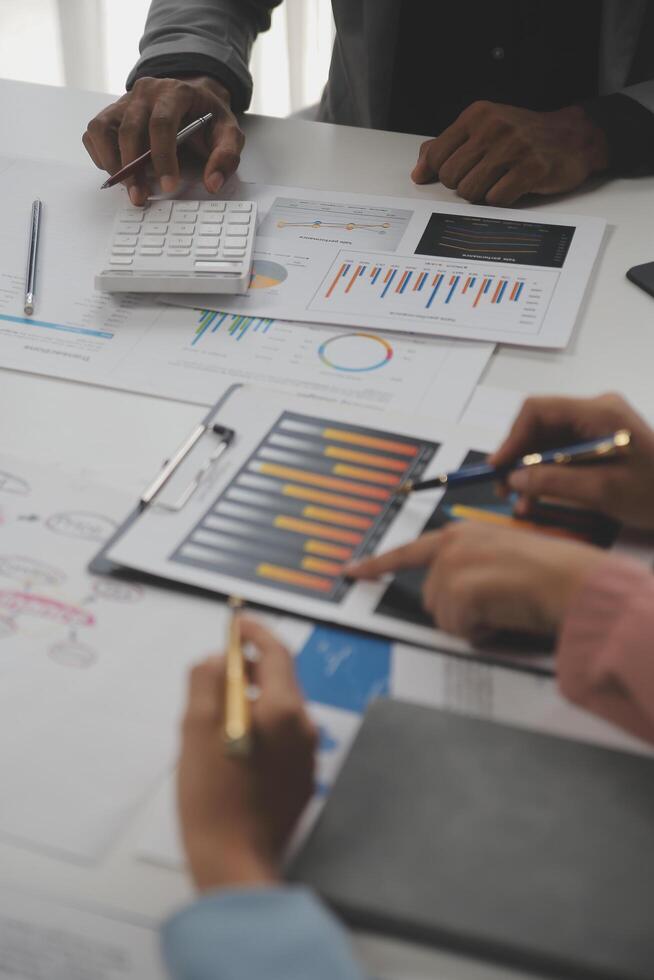 Close up of Business team analyzing income charts and graphs with modern laptop computer. Business analysis and strategy concept. photo