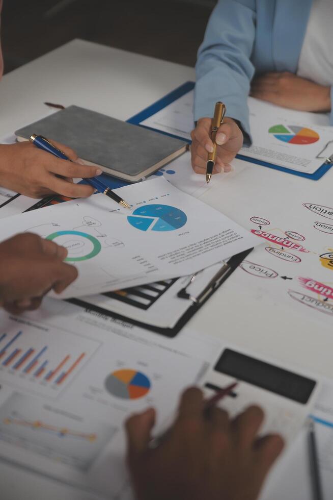 Close up of Business team analyzing income charts and graphs with modern laptop computer. Business analysis and strategy concept. photo