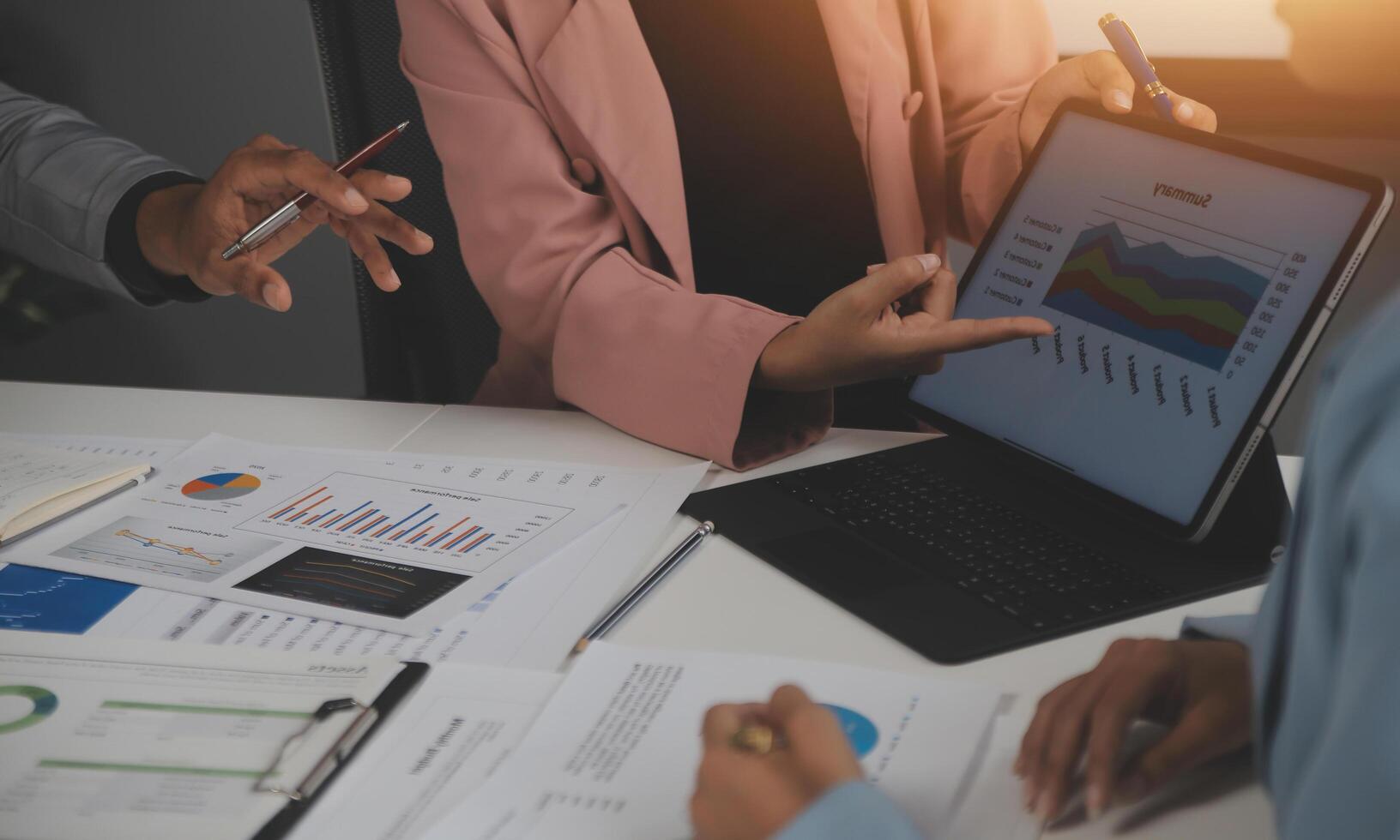 Close up of Business team analyzing income charts and graphs with modern laptop computer. Business analysis and strategy concept. photo