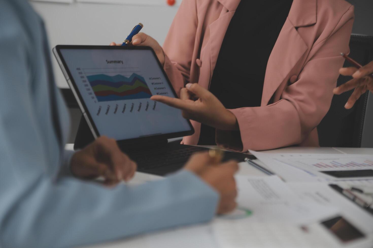 Close up of Business team analyzing income charts and graphs with modern laptop computer. Business analysis and strategy concept. photo