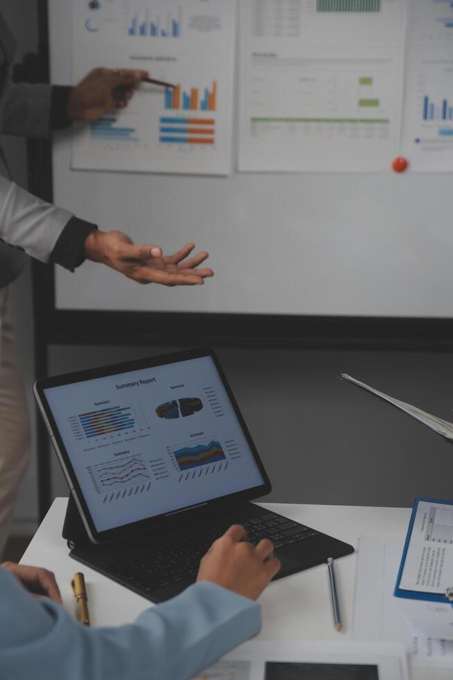 Close up of Business team analyzing income charts and graphs with modern laptop computer. Business analysis and strategy concept. photo