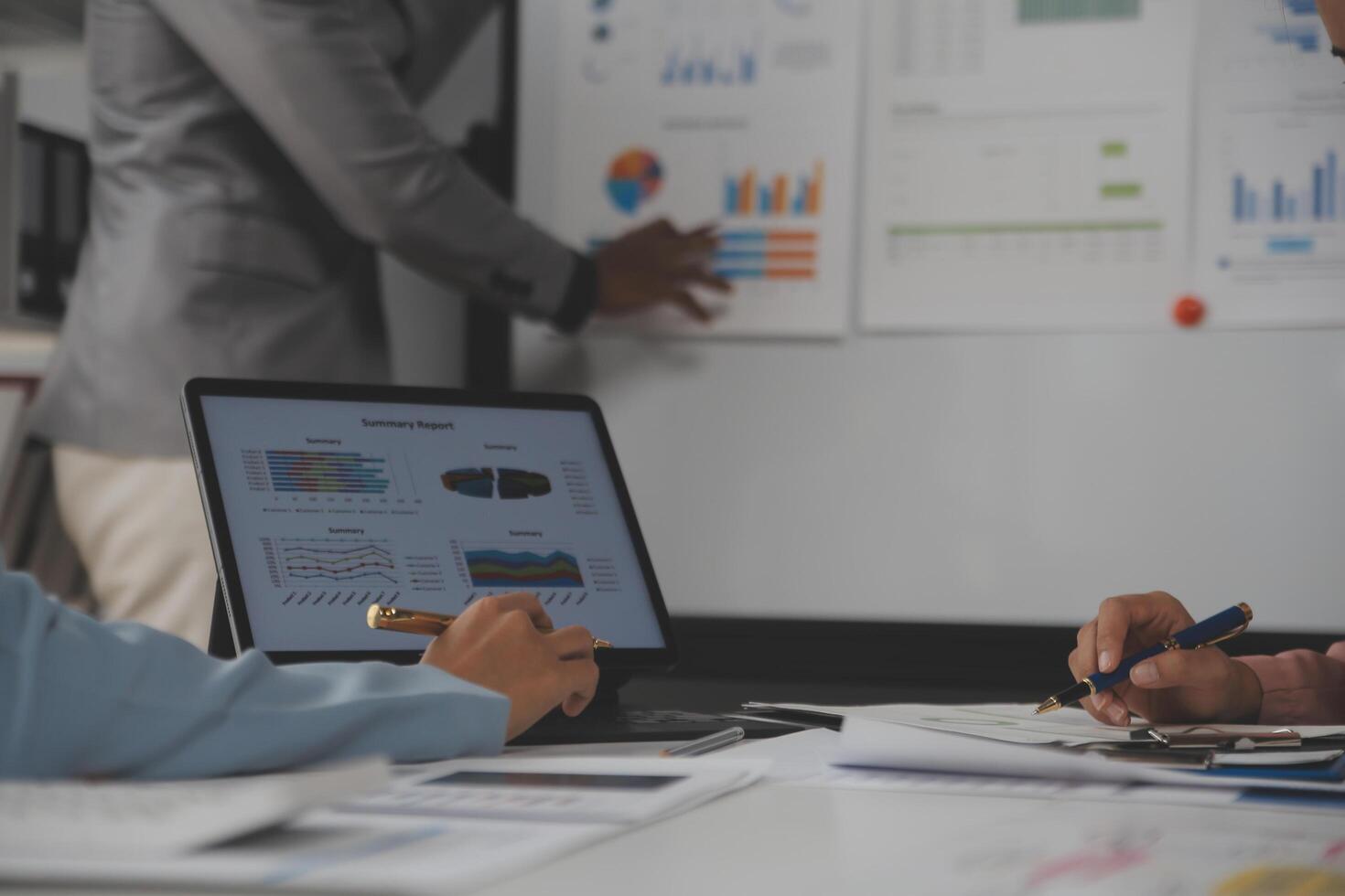 Close up of Business team analyzing income charts and graphs with modern laptop computer. Business analysis and strategy concept. photo