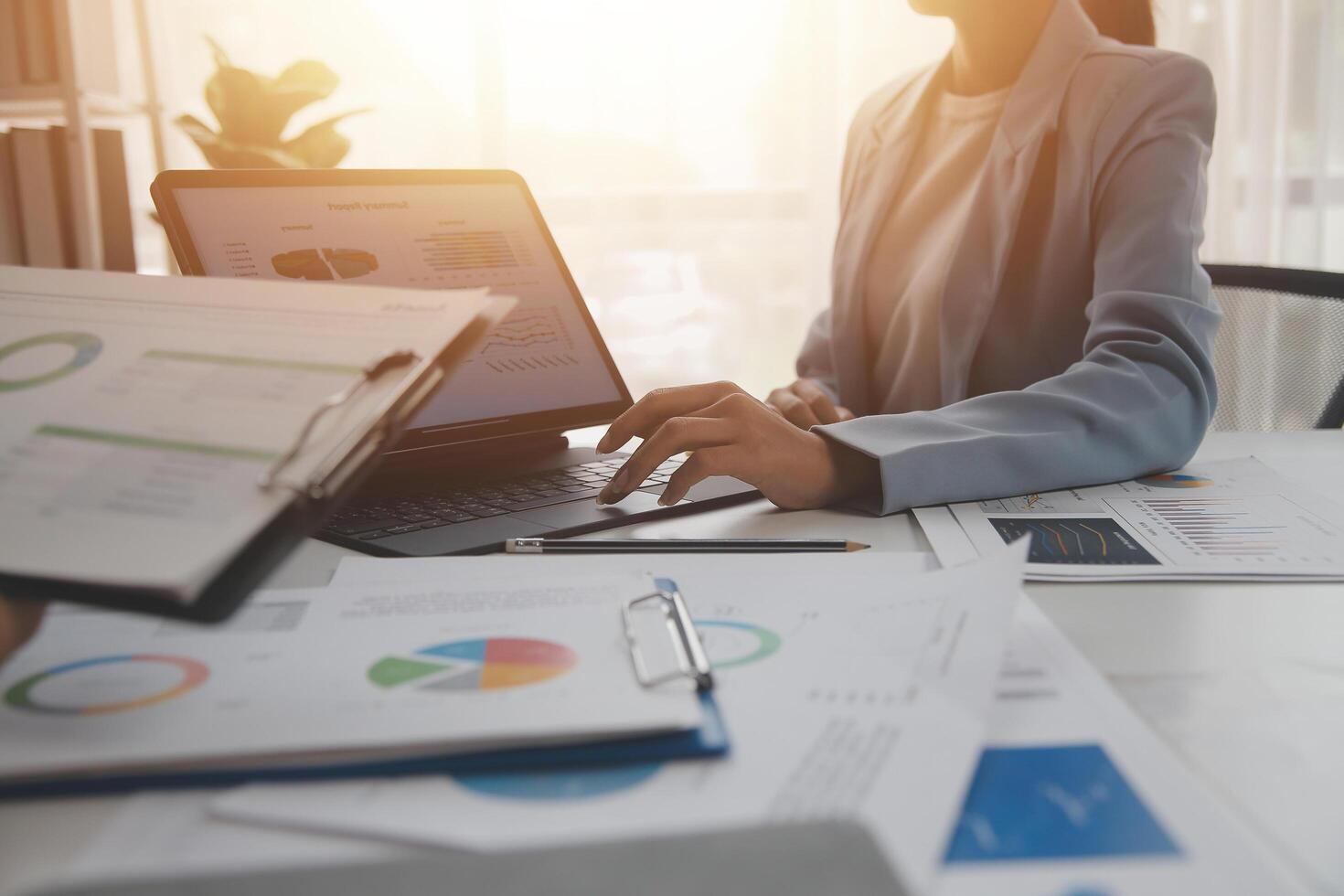 Close up of Business team analyzing income charts and graphs with modern laptop computer. Business analysis and strategy concept. photo