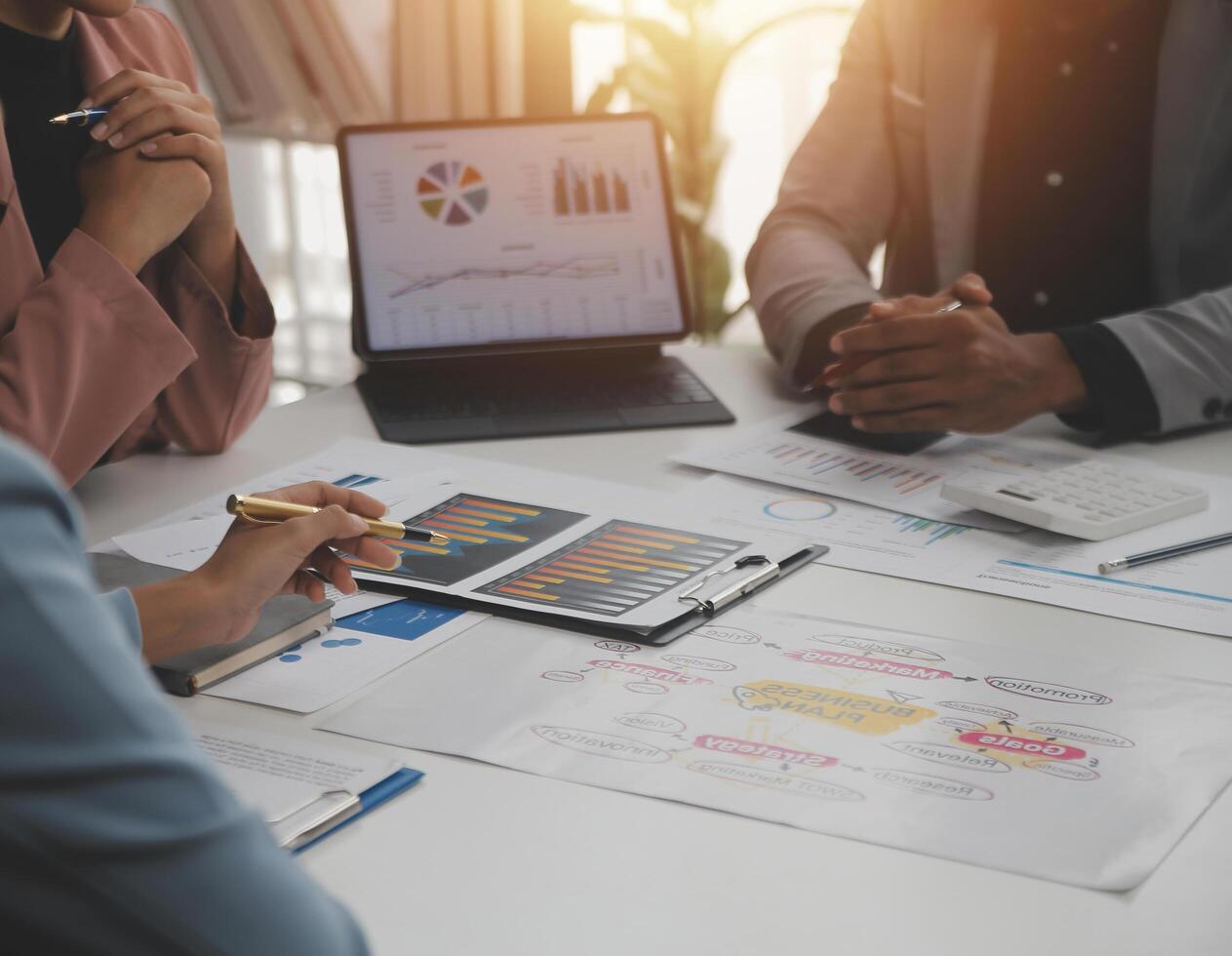 Close up of Business team analyzing income charts and graphs with modern laptop computer. Business analysis and strategy concept. photo