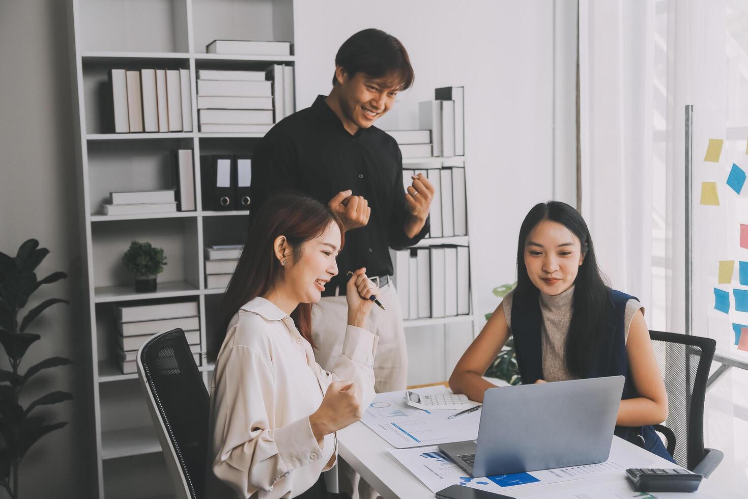 Financial analysts analyze business financial reports on a digital tablet planning investment project during a discussion at a meeting of corporate showing the results of their successful teamwork. photo