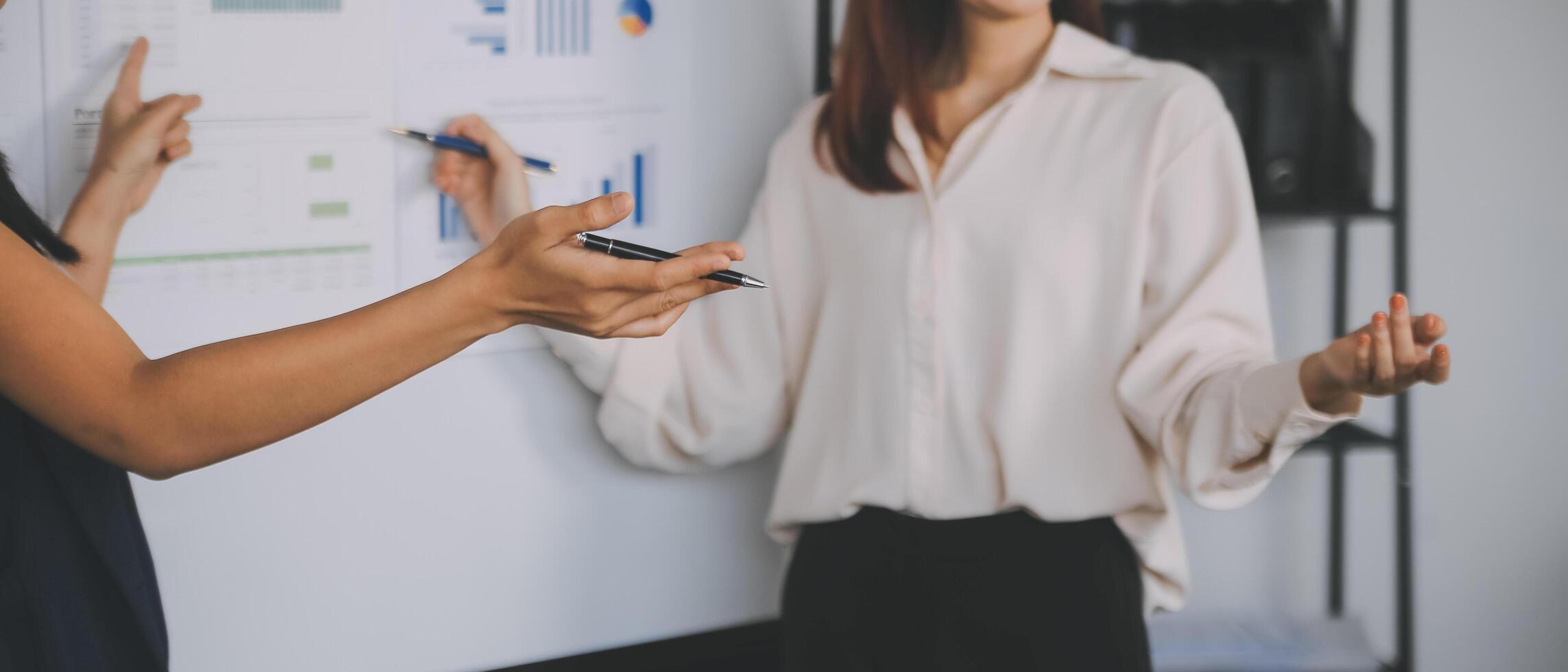 Financial analysts analyze business financial reports on a digital tablet planning investment project during a discussion at a meeting of corporate showing the results of their successful teamwork. photo