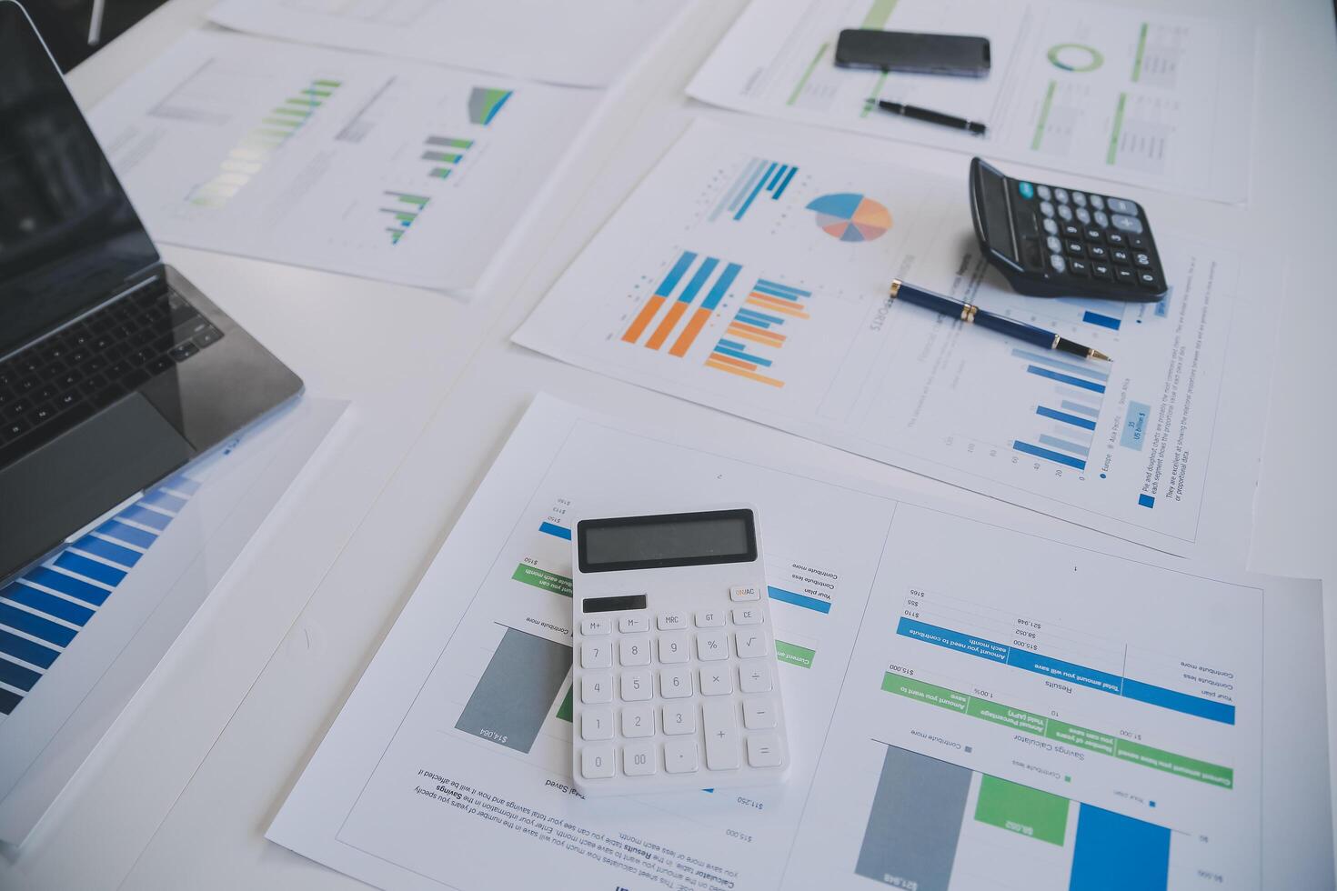 Financial analysts analyze business financial reports on a digital tablet planning investment project during a discussion at a meeting of corporate showing the results of their successful teamwork. photo