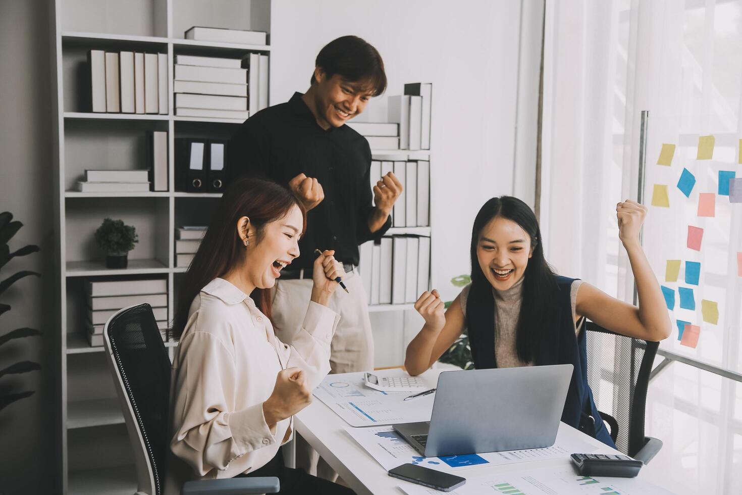 Financial analysts analyze business financial reports on a digital tablet planning investment project during a discussion at a meeting of corporate showing the results of their successful teamwork. photo