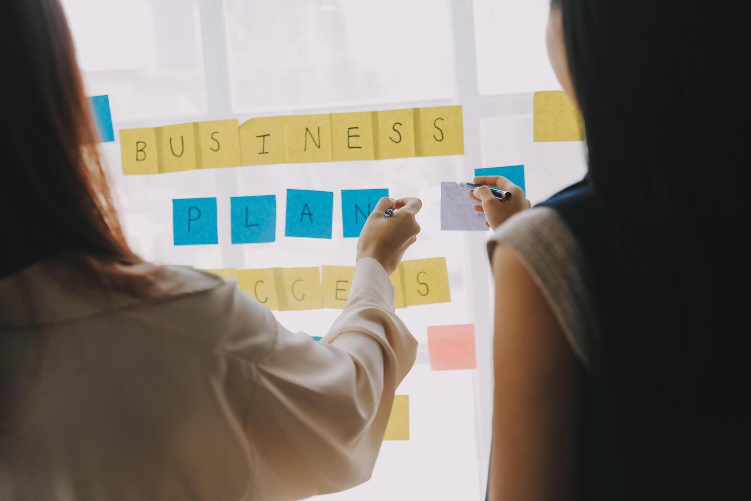 Financial analysts analyze business financial reports on a digital tablet planning investment project during a discussion at a meeting of corporate showing the results of their successful teamwork. photo