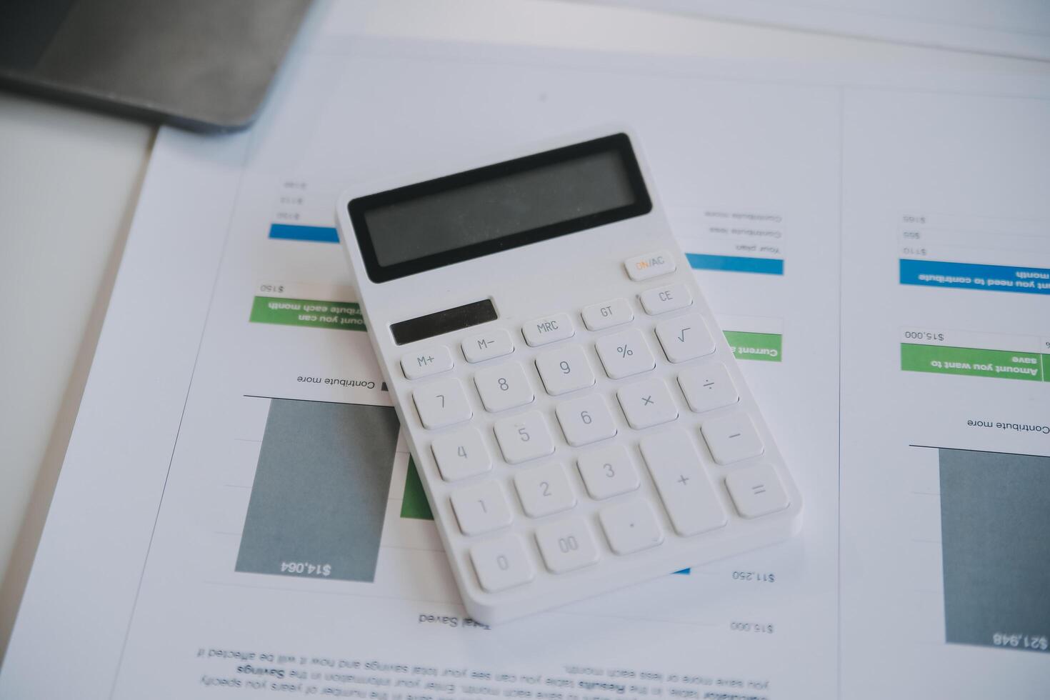 Financial analysts analyze business financial reports on a digital tablet planning investment project during a discussion at a meeting of corporate showing the results of their successful teamwork. photo