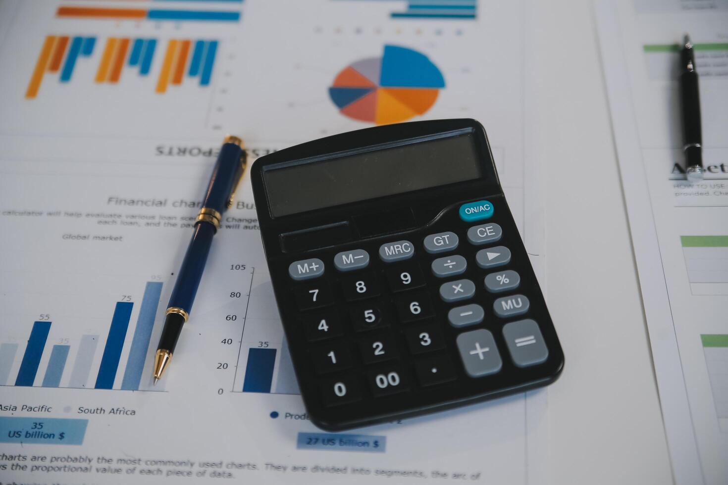 Financial analysts analyze business financial reports on a digital tablet planning investment project during a discussion at a meeting of corporate showing the results of their successful teamwork. photo