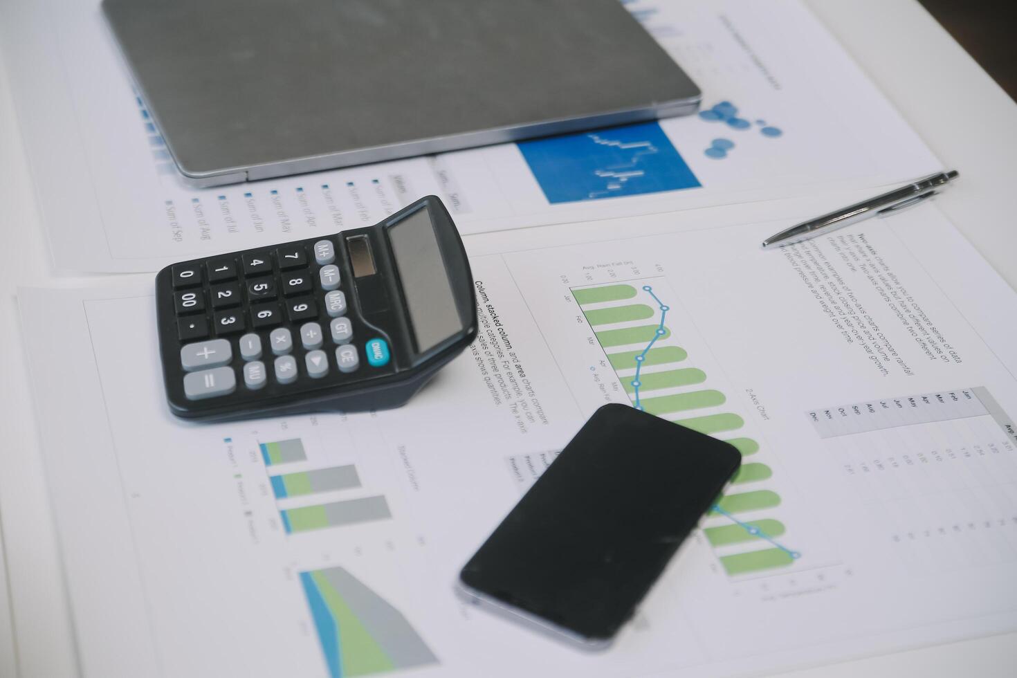 Financial analysts analyze business financial reports on a digital tablet planning investment project during a discussion at a meeting of corporate showing the results of their successful teamwork. photo