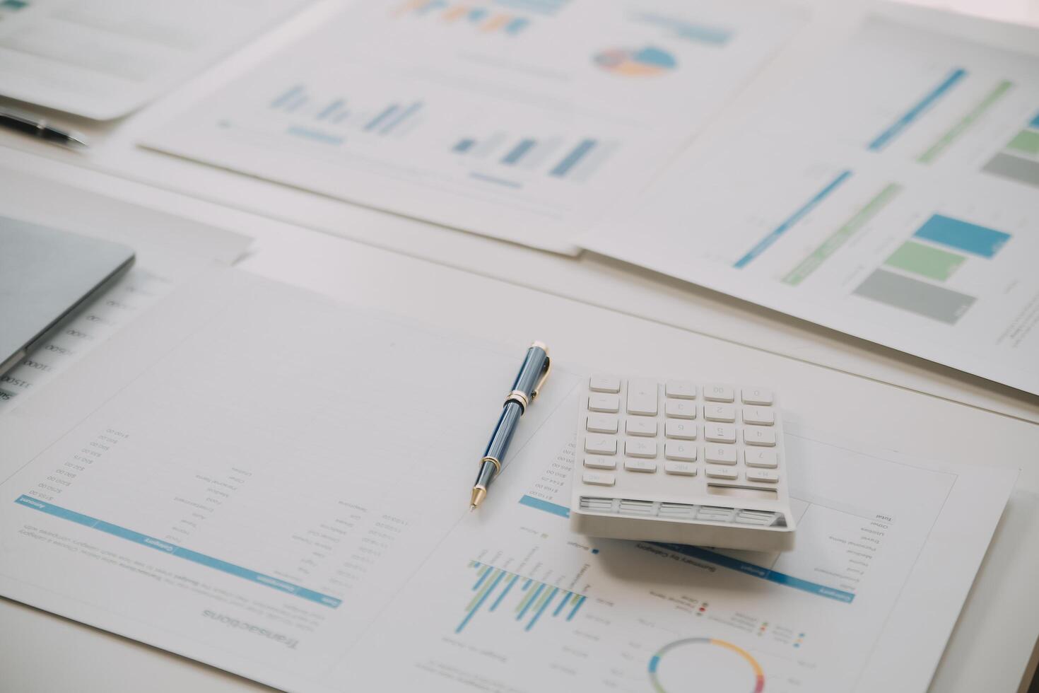 Financial analysts analyze business financial reports on a digital tablet planning investment project during a discussion at a meeting of corporate showing the results of their successful teamwork. photo