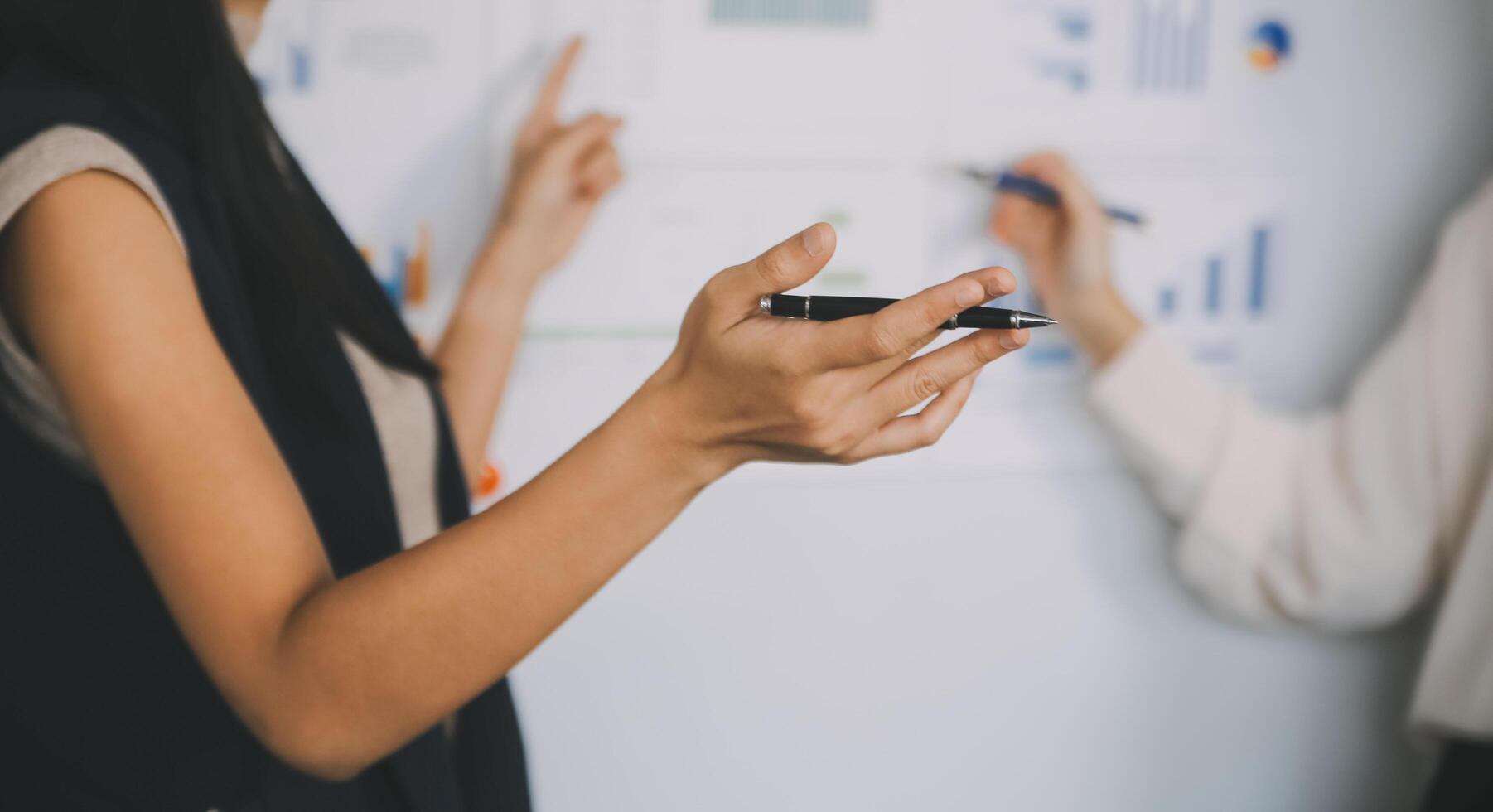 Financial analysts analyze business financial reports on a digital tablet planning investment project during a discussion at a meeting of corporate showing the results of their successful teamwork. photo