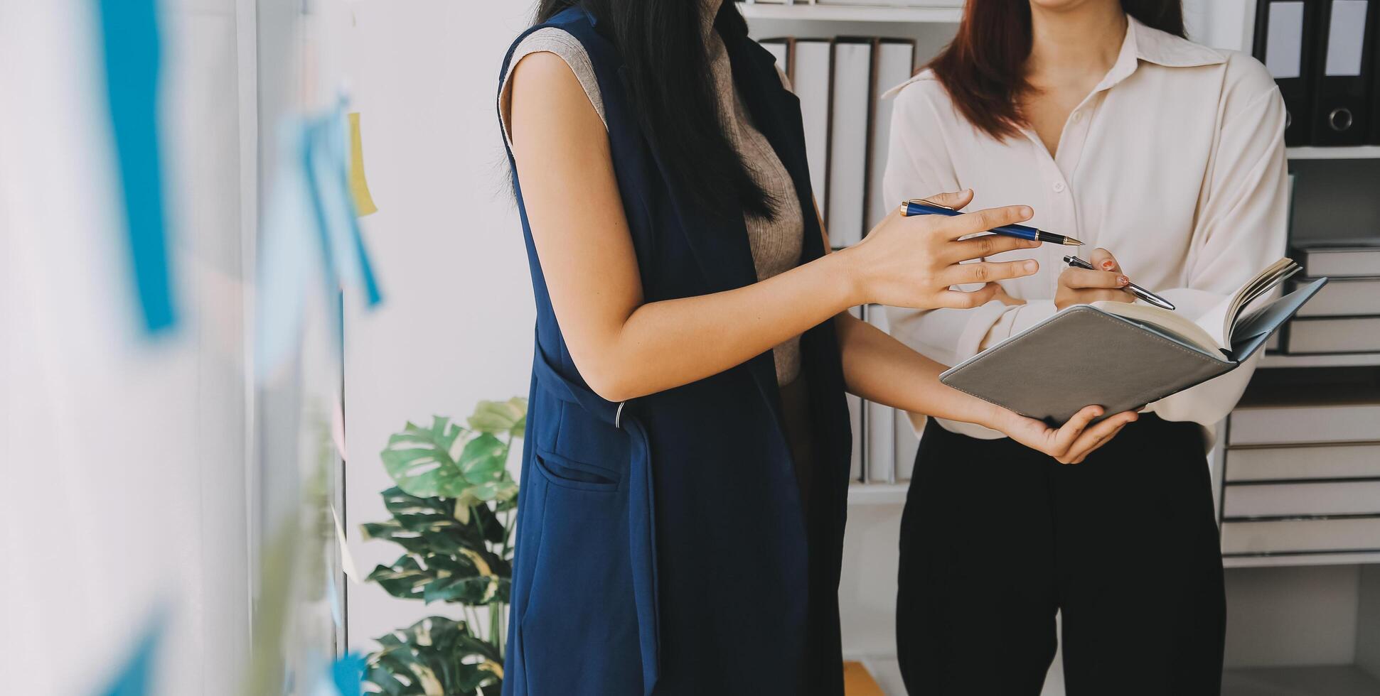 Financial analysts analyze business financial reports on a digital tablet planning investment project during a discussion at a meeting of corporate showing the results of their successful teamwork. photo