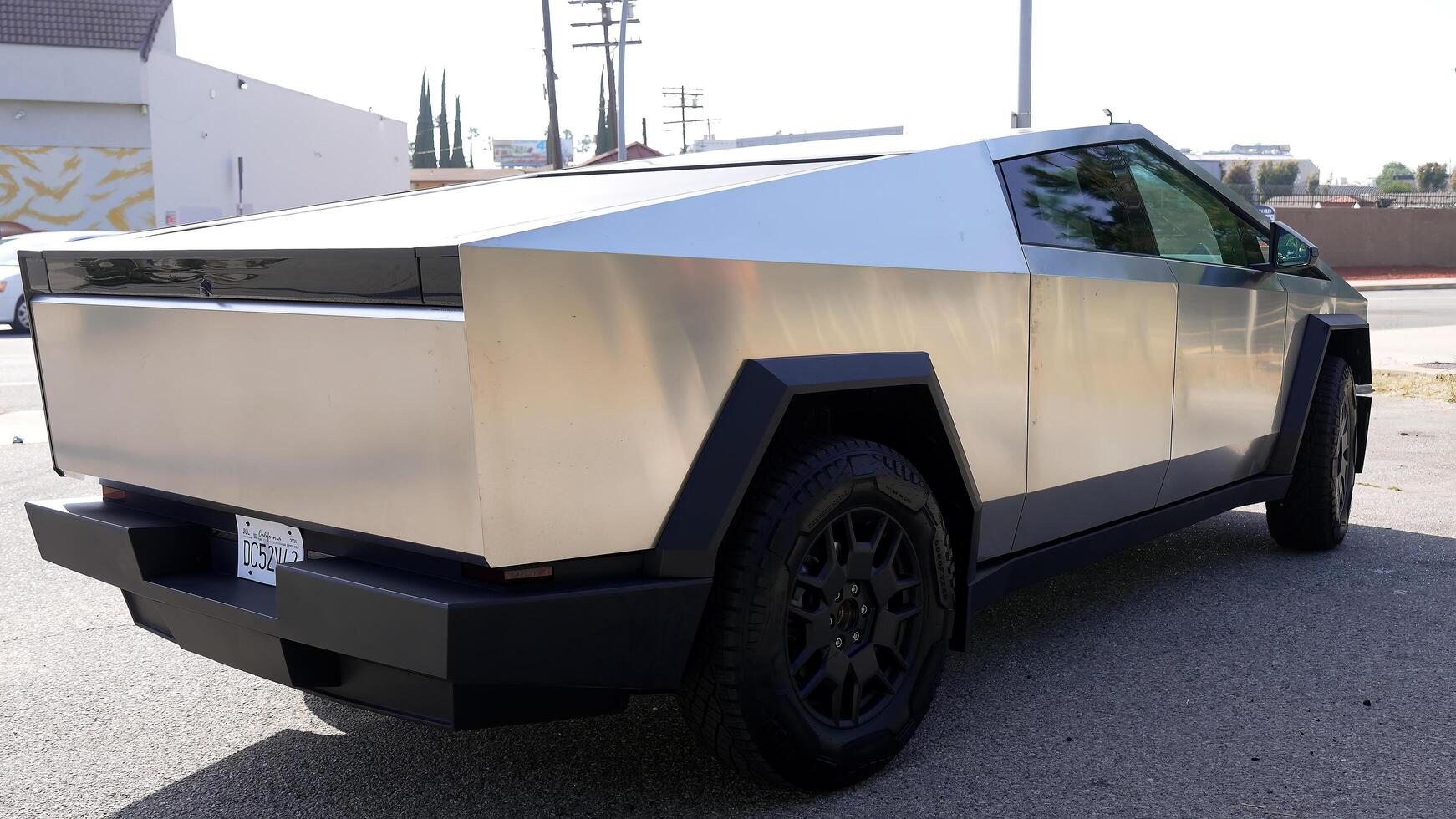 Modern electric car, Tesla Cybertruck outdoors. The concept of modern automotive technologies. Concept of using electric cars to protect the environment and transportation photo