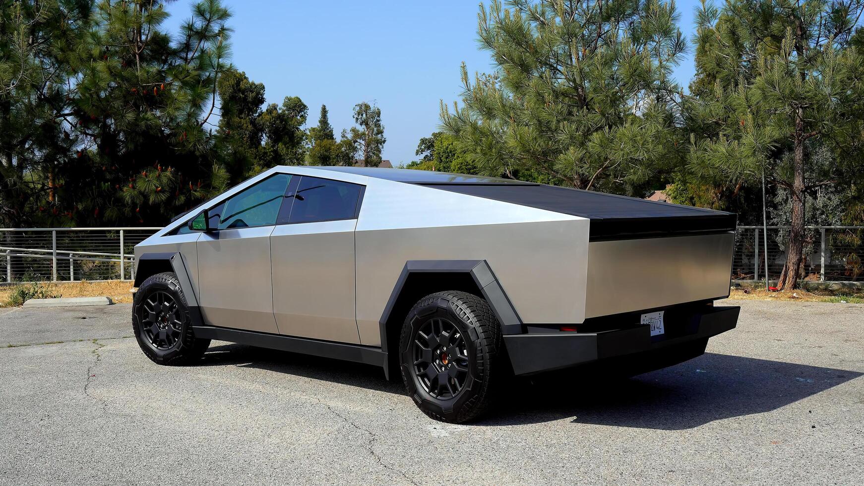 Modern electric car, Tesla Cybertruck outdoors. The concept of modern automotive technologies. Concept of using electric cars to protect the environment and transportation photo