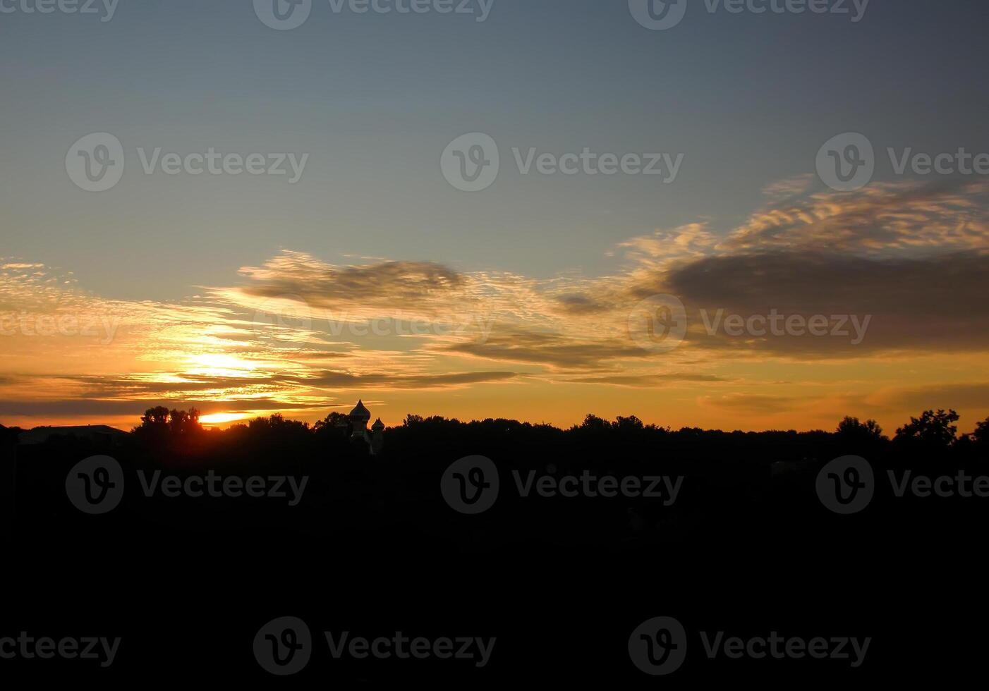 Beautiful cloudscape. Sunset landscape with forest. photo