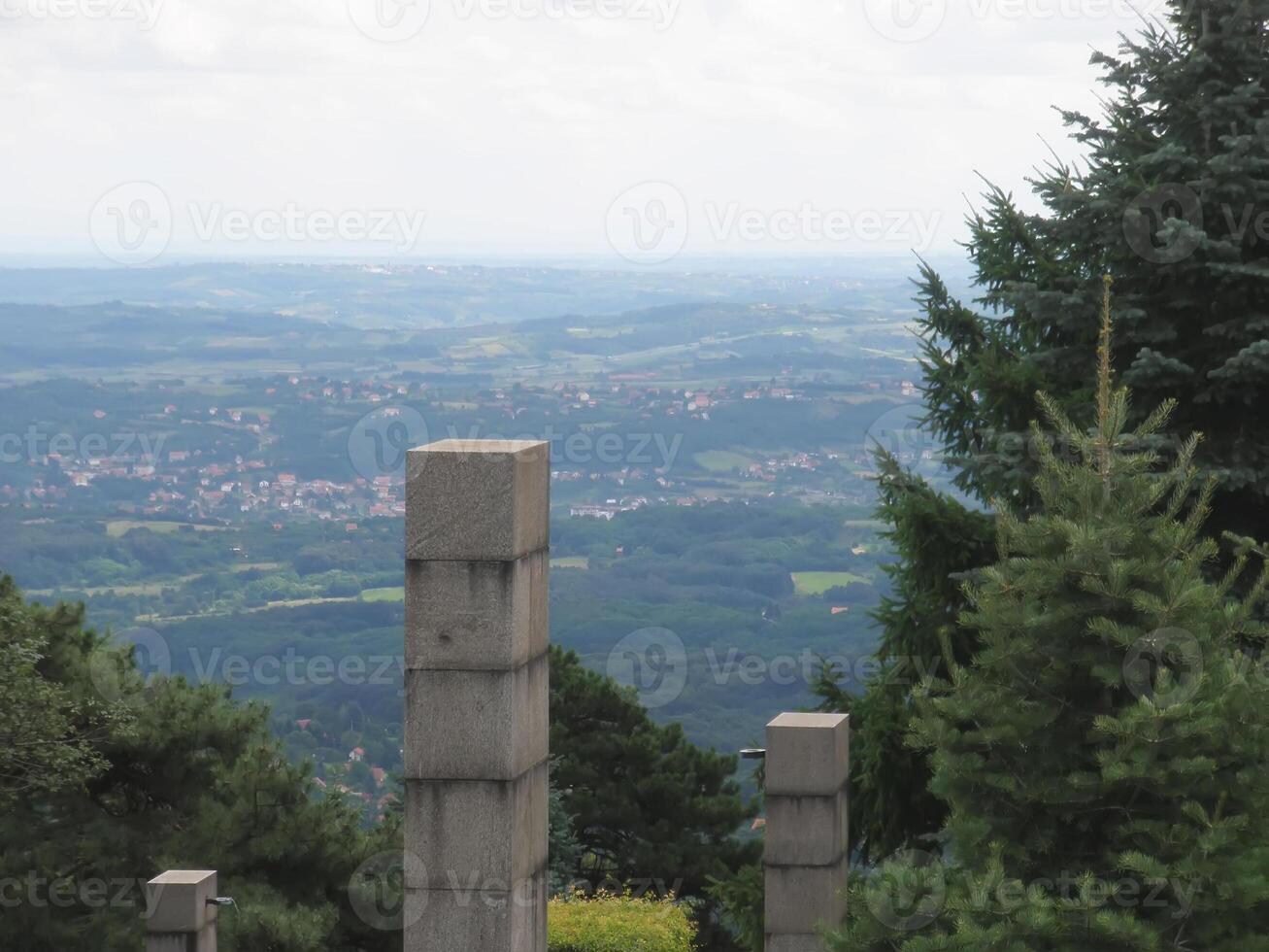 Top view from high hill in Serbia. Spruce trees and fields. photo