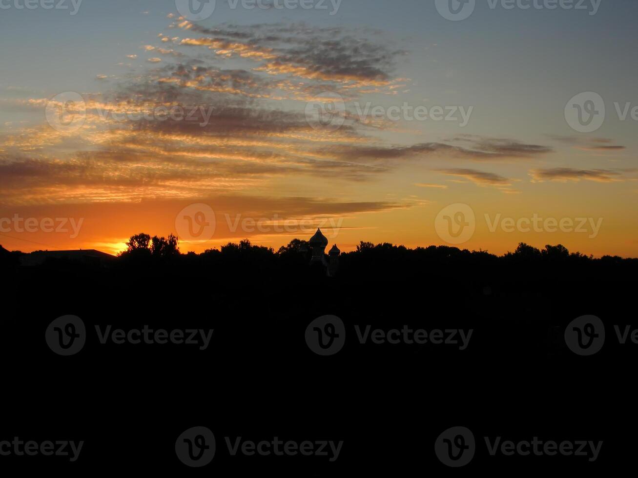 Beautiful cloudscape. Sunset landscape with forest. photo