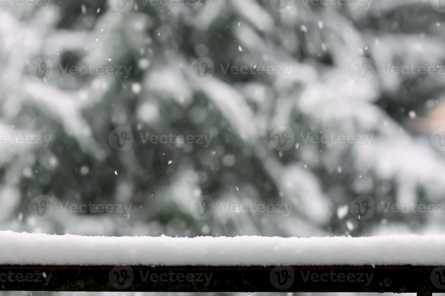 Snow on the balcony railing. Winter details photo
