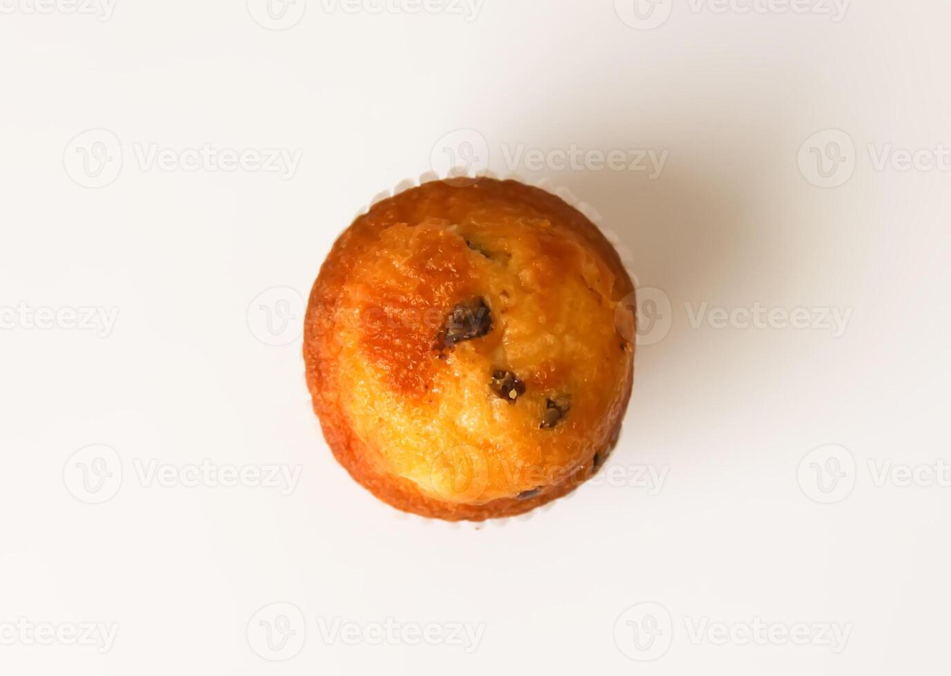 Sweet muffin cup cake closeup on white background. photo