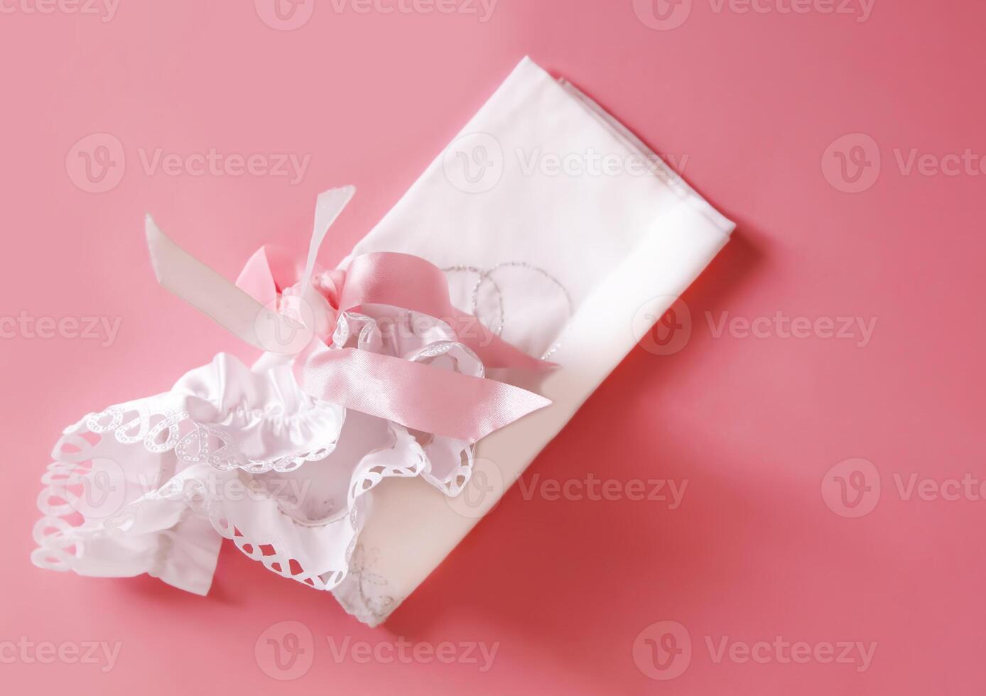 The bride's garter on a pink background. photo