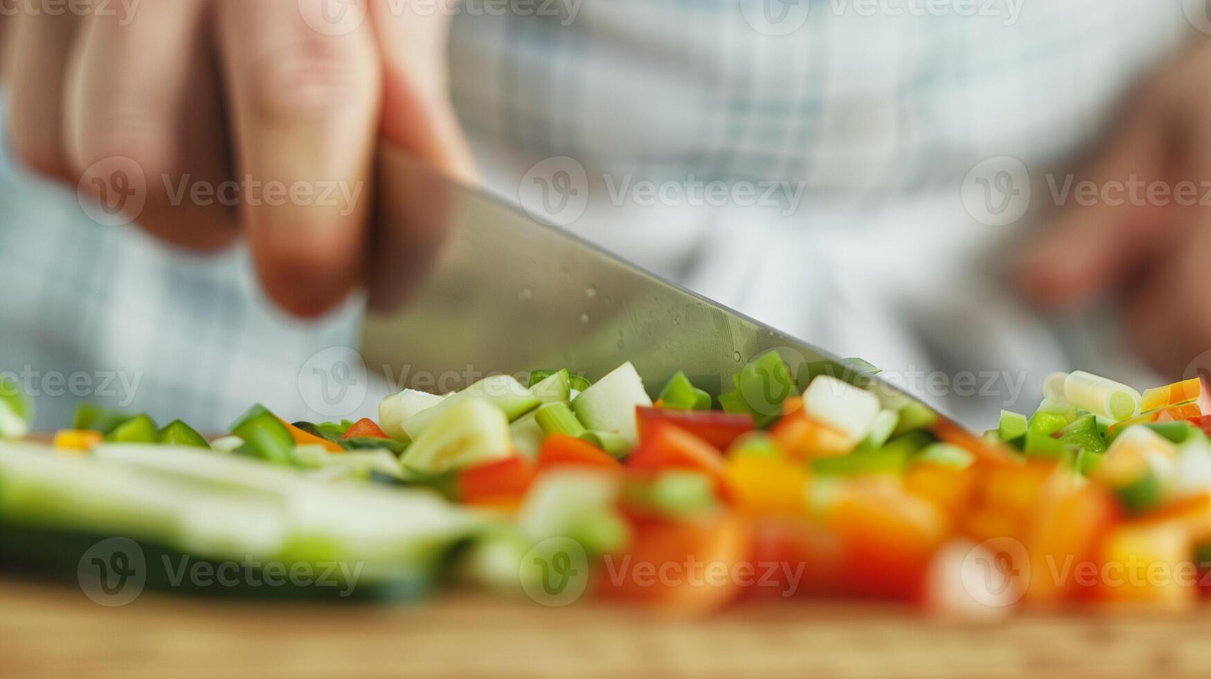 Close Up of Hands Chopping Fresh Vegetables in Kitchen for Healthy Cooking Lifestyle with Knife photo